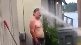 Man Sprays Neighbor With Hose
