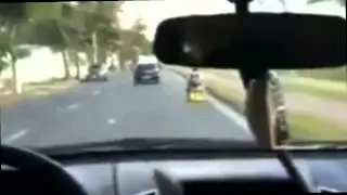 A Normal Day in Brazil: A Guy Riding a Beer Box Car on Streets