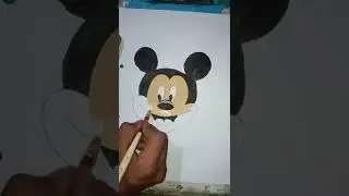 How to colour on the face of Mickey Mouse with artist tube water colour.