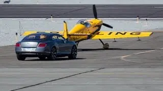 Bentley Continental GT versus David Martin's Cap 232 aerobatic plane &copy; Keith Breazeal