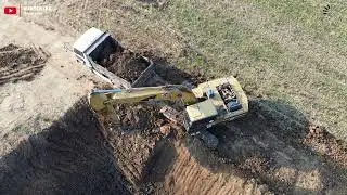 Land-filling operation! ⛰️ Watch the powerful teamwork between an excavator, dump truck, and tractor