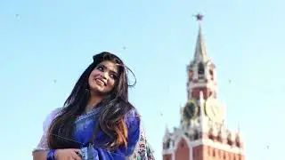 Young Indian woman posing in Moscow with Spasskaya Tower