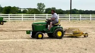 Soilmover Mini Earth Scraper Working behind John Deere 332 Diesel Garden Tractor
