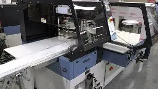 Building material packaging on a Conflex side sealer