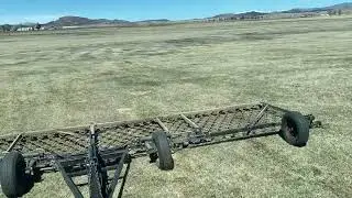 Is your job better than dragging manure in this Colorado hay field?  I doubt it!