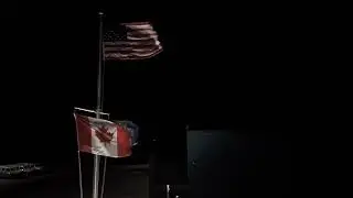 US and Canadian Flags Waving at Night | Border Crossing