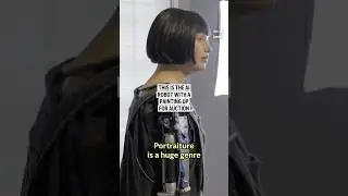 This is the AI robot with a painting up for auction