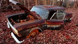 ABANDONED Junkyard full of cars from the 1950's decaying in the Woods