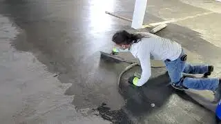 feather finishing the floor before glue down luxury vinyl plank installation.