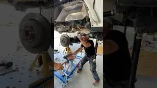 Getting the rear axle and suspension installed in the Gladiator