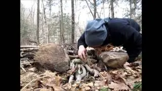 Starting a fire with a knife, charred cedar bark and quartz.