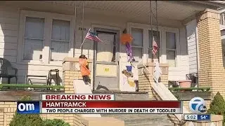 Two charged in infant's death