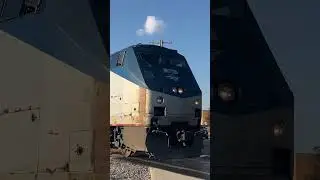 P42 leaving royal oak with Amtrak baggage car