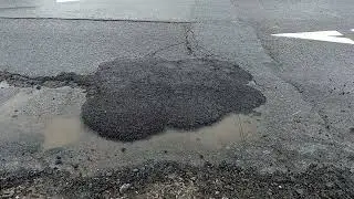 Throw 'n' go winter pothole repair.