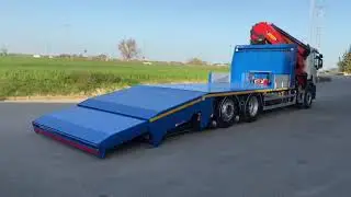 Plataforma porta maquinaria con rampa hidráulica
