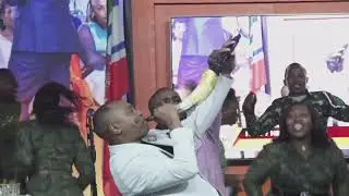 Bishop Ben shouts out loudly to the crowd with a vuvuzela welcoming the new year 2026