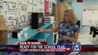 Katia Uriarte talks with a local teacher about returning to school