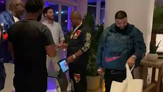 DJ Khaled meeting a bunch of robots