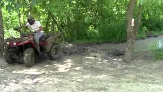 2004 Kawasaki Prairie 360 4x4 ATV getting winched out of mudhole. Haspen Acres Indiana