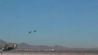 2 Skyraiders Fly by