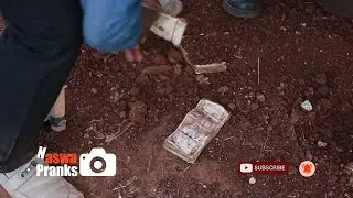 Digging out money.