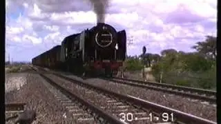 South African Railways class 25NC 3488 working up Modder River bank 1991