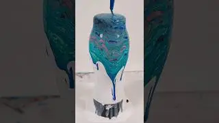 Blue paint pour on a glass vase