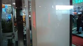 Panoramic elevator including glass shaft and stand alone steel structure.