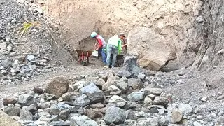 When the miners are not scraping sand from the cliffs, they are just sifting.