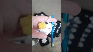 Crocheting petals on a daisy granny square