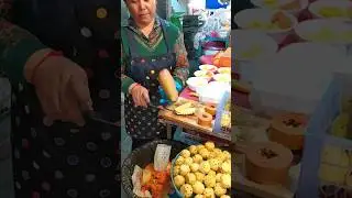 Slicing a large ripe mango.  Thailand #slicing #large #ripe #mango #thailand #streetfood #fruit