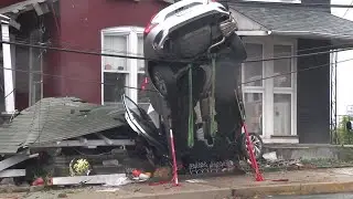 Car dangles from wires after crashing into Columbia, Lancaster County, home