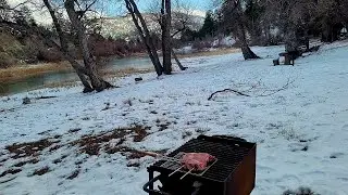 Grilling sirloin steak in the snow at Jackson Lake in Wrightwood California