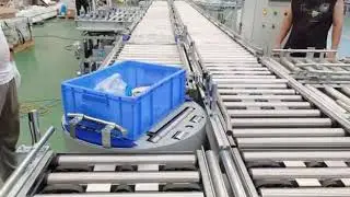Roller conveyor line with pop up diverter sorter and rotary roller table
