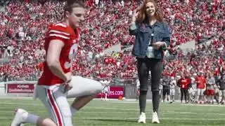 American Football player proposes to his girlfriend on football field