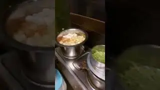 Hardworking man cooks dinner in his shop after closing it for the day