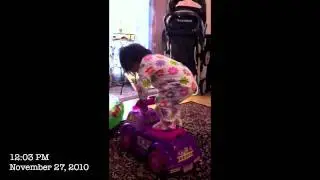 Marivette Standing on Toy Car