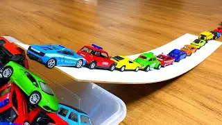 Various Bigger and Smaller Diecast Model Cars Moving Down On Slider #11