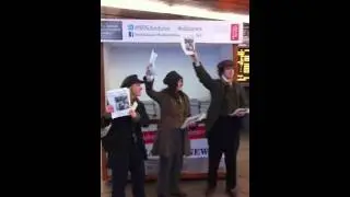 Dickensian Newspaper Vendors at Kings Cross Station