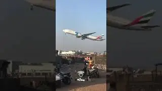 Emirates B777 roaring past Mumbai&rsquo;s slums to the land of millioners. 🛫.  #shorts #viral #viralvideo