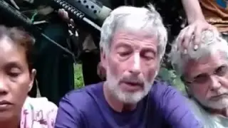 Two Canadians Seen on Philippines Hostage Video
