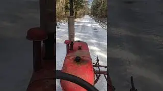 Farmall super c takes a drive on the ice