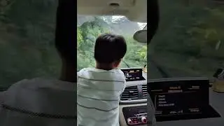 Cute kid enjoying monsoon #ghat #rains #hills #monsoon #cutebaby #baby #kids #ytshort #shorts #happy
