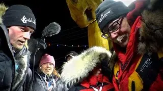 Dallas and Mitch Seavey greet each other after finishing Iditarod