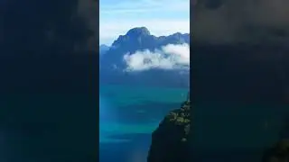 Cloud-Kissed Peaks Floating Above Paradise: Island Serenity