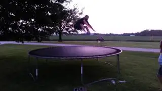 54 year old man does toe touches on trampoline.