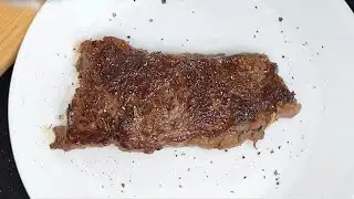 Cooking a bison New York strip steak in a cast-iron skillet #cooking #steak #recipe