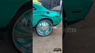 dodge challenger sitting very tall on 34 inch Forgiato Wheels chrome teal wrap suicide doors
