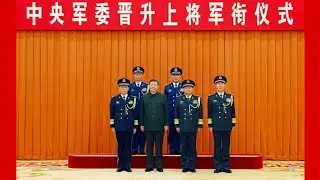President Xi Jinping presents orders to promote two PLA military officers to rank of general