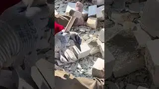Shaping Stone Blocks Manually using a hammer and chisel to refine rough edges for construction